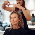 Woman, hair and salon for haircut with hairdresser for beauty, style or makeover. Customer, beautic.